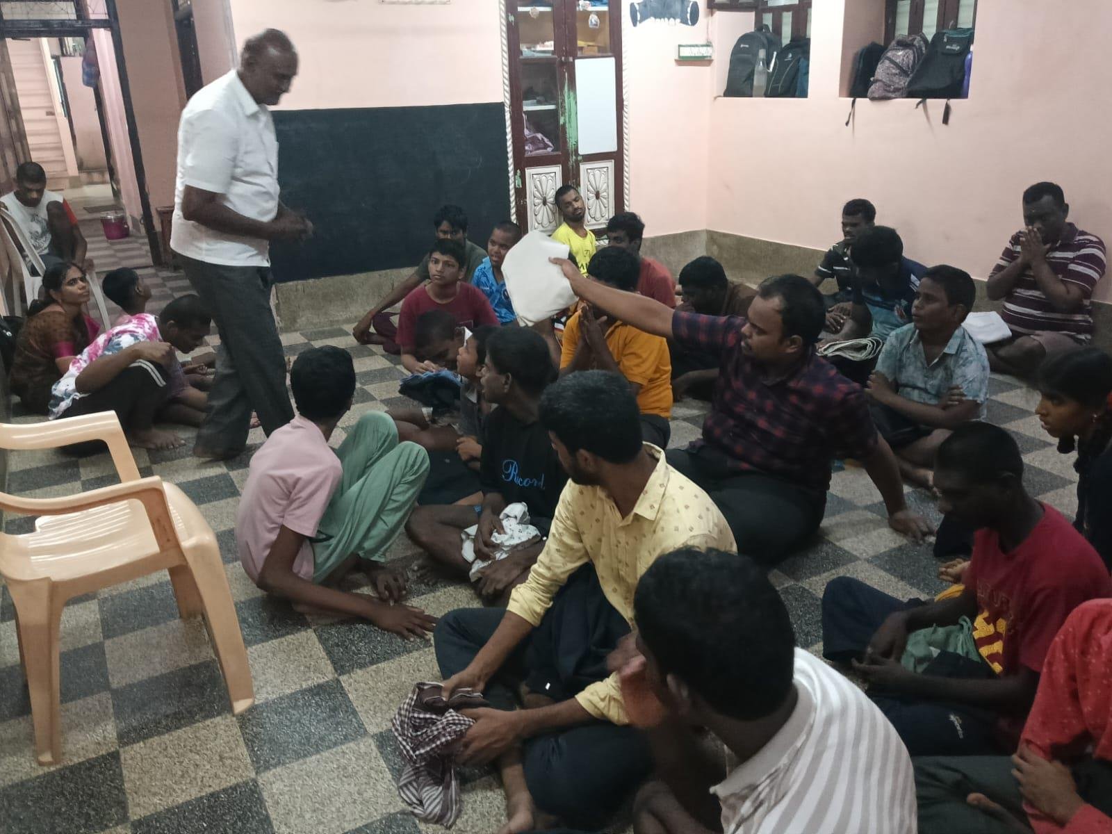 Youth receiving supplies at community centre